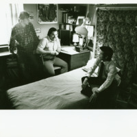 Students talk inside a dorm room, ca. 1970s.