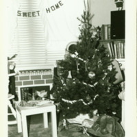 A dorm room decorated for Christmas, ca. 1970s.