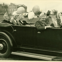 Levering Tyson and other men ride in a car during Alumni Day, 1939.