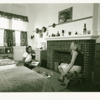 Students talk inside a dorm room, ca. 1970s.
