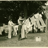 V-12 students hanging laundry.