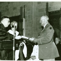 President Tyson presenting diploma.