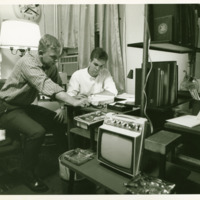 Students talk inside a dormitory, ca. 1970s.